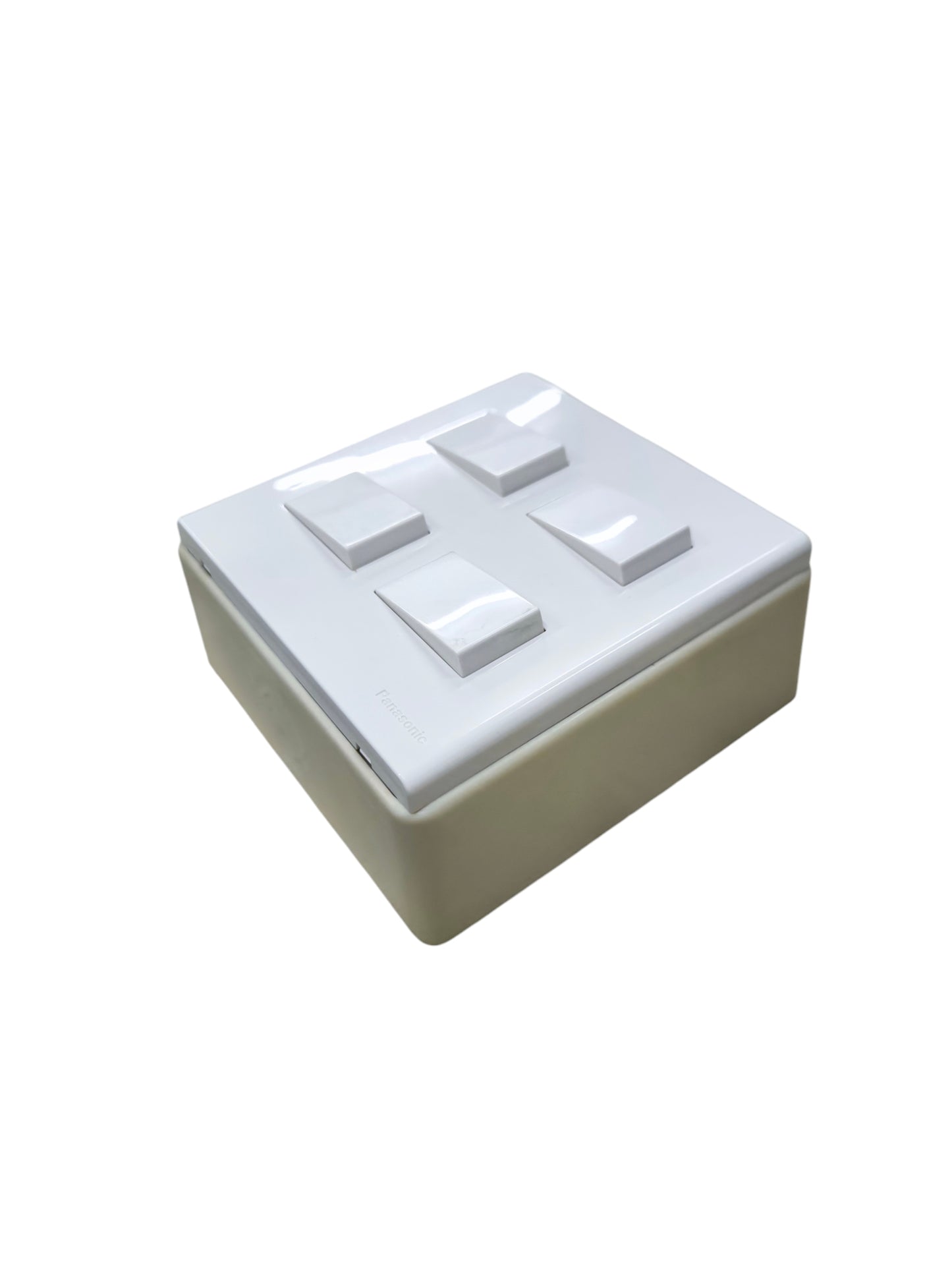 White Panasonic 4 gang switch with four rocker buttons in a square design for wall mounting