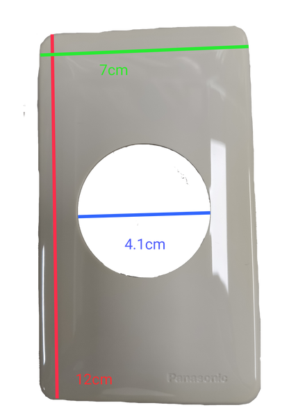 Panasonic white faceplate with circular cutout for NEMA L6 250V industrial outlet 7cm by 12cm 4.1cm hole