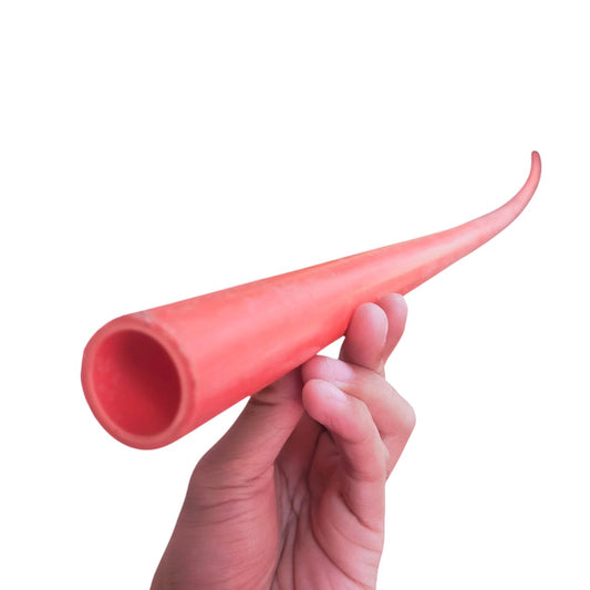 Hand holding a flexible 20mm PVC electrical pipes in red by Atlanta for electrical conduit use