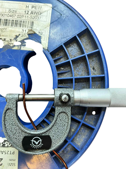 Philflex heavy formix magnet wire on spool with a measuring tool for accurate gauge assessment