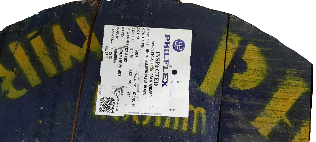 Wooden spool reel with Philflex 30mm welding cable product label on industrial painted drum