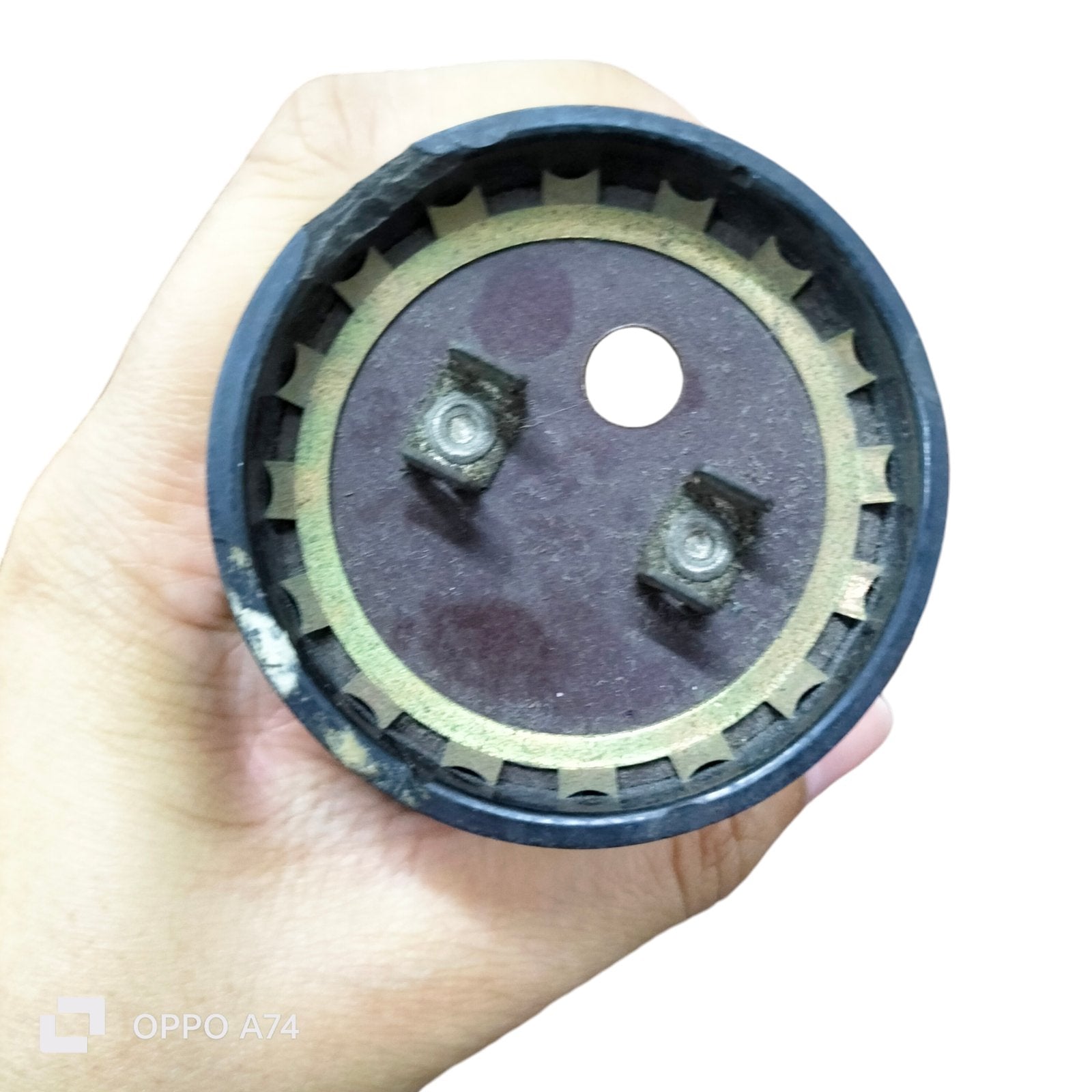 Close-up of Motor Starting Capacitor 233-280UF fan part from Philips Sprague Mallory held in hand