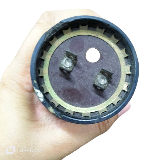 Close-up of Motor Starting Capacitor 233-280UF fan part from Philips Sprague Mallory held in hand