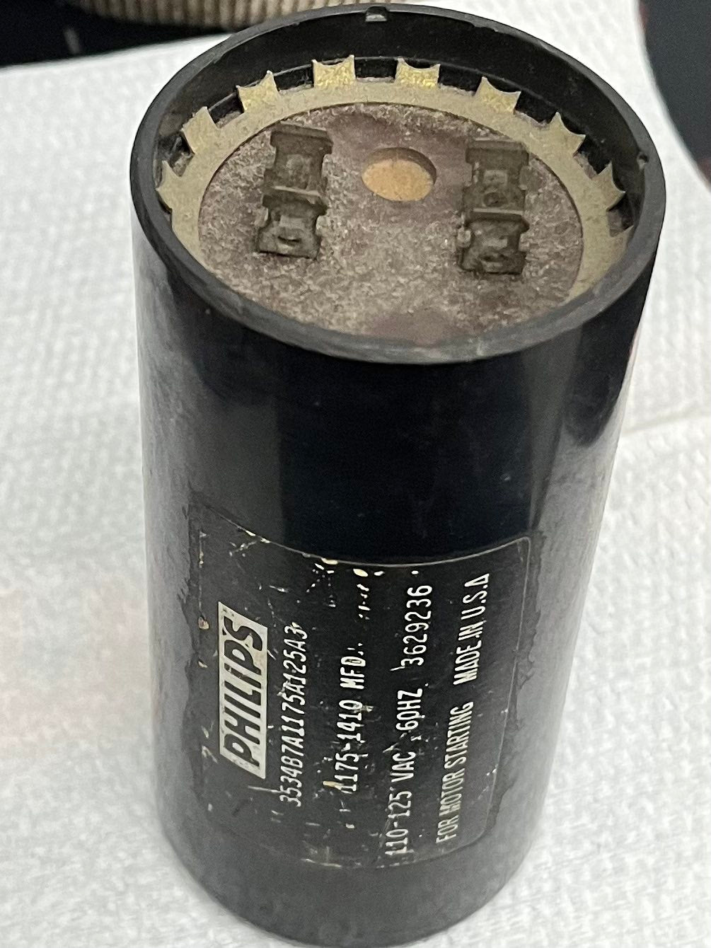 Philips electrical Starting Capacitor 1175-1410MFD black cylindrical component with metal terminals