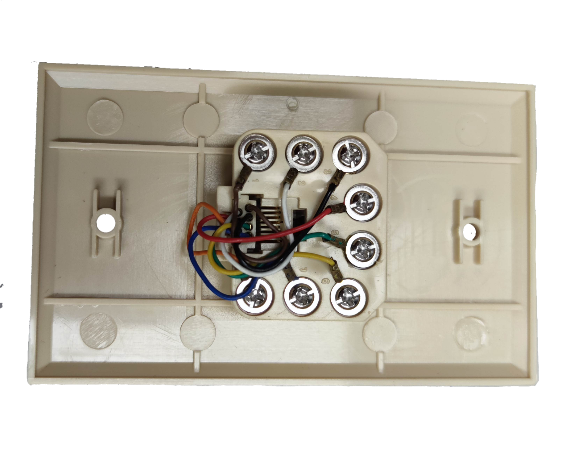 Back view of Taiwan made RJ45 wall socket for ethernet showing wiring and screw terminals