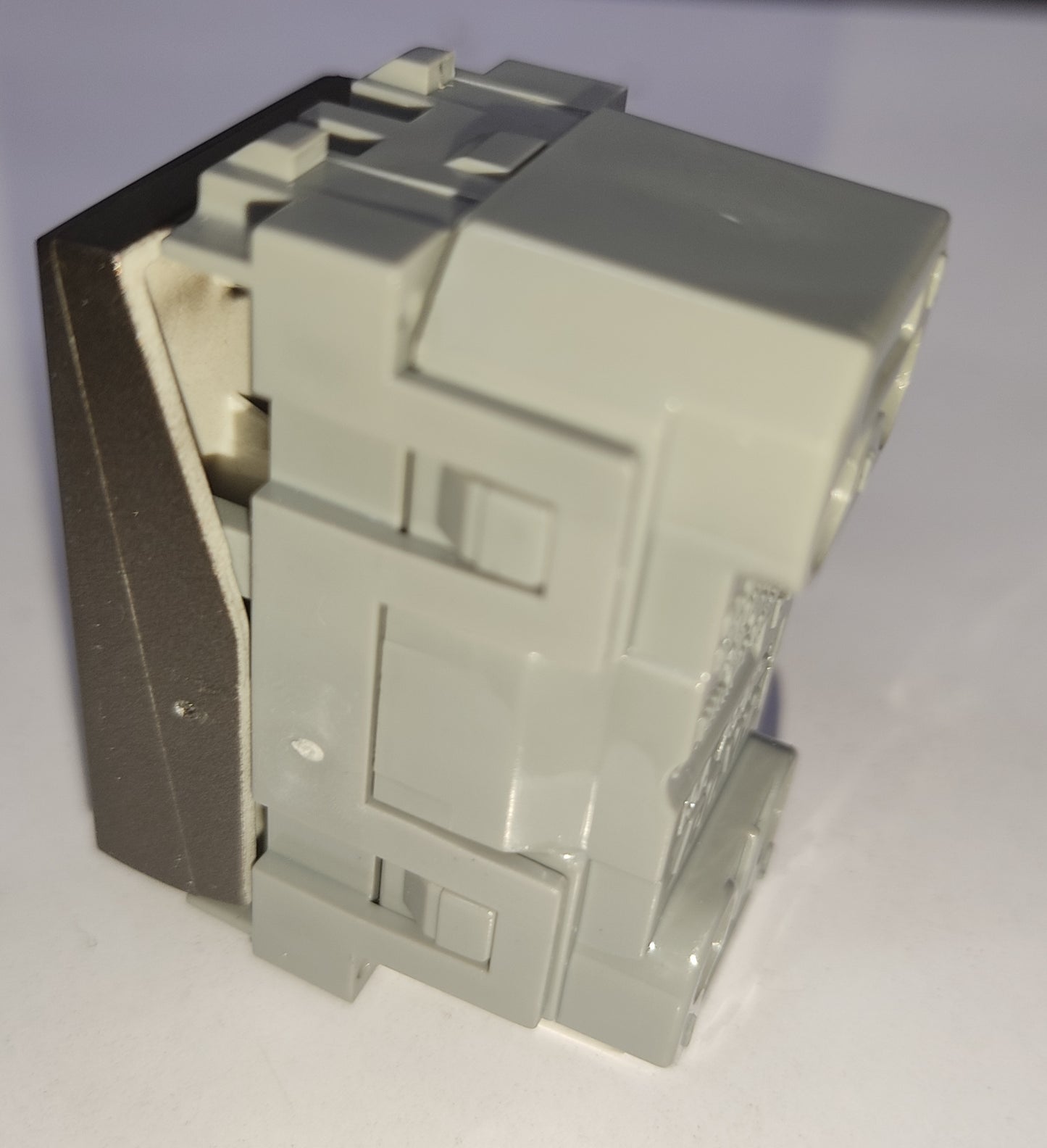 Royu 3 Way Switch Device Dark Gray modular electrical switch module with gray plastic body and dark gray faceplate