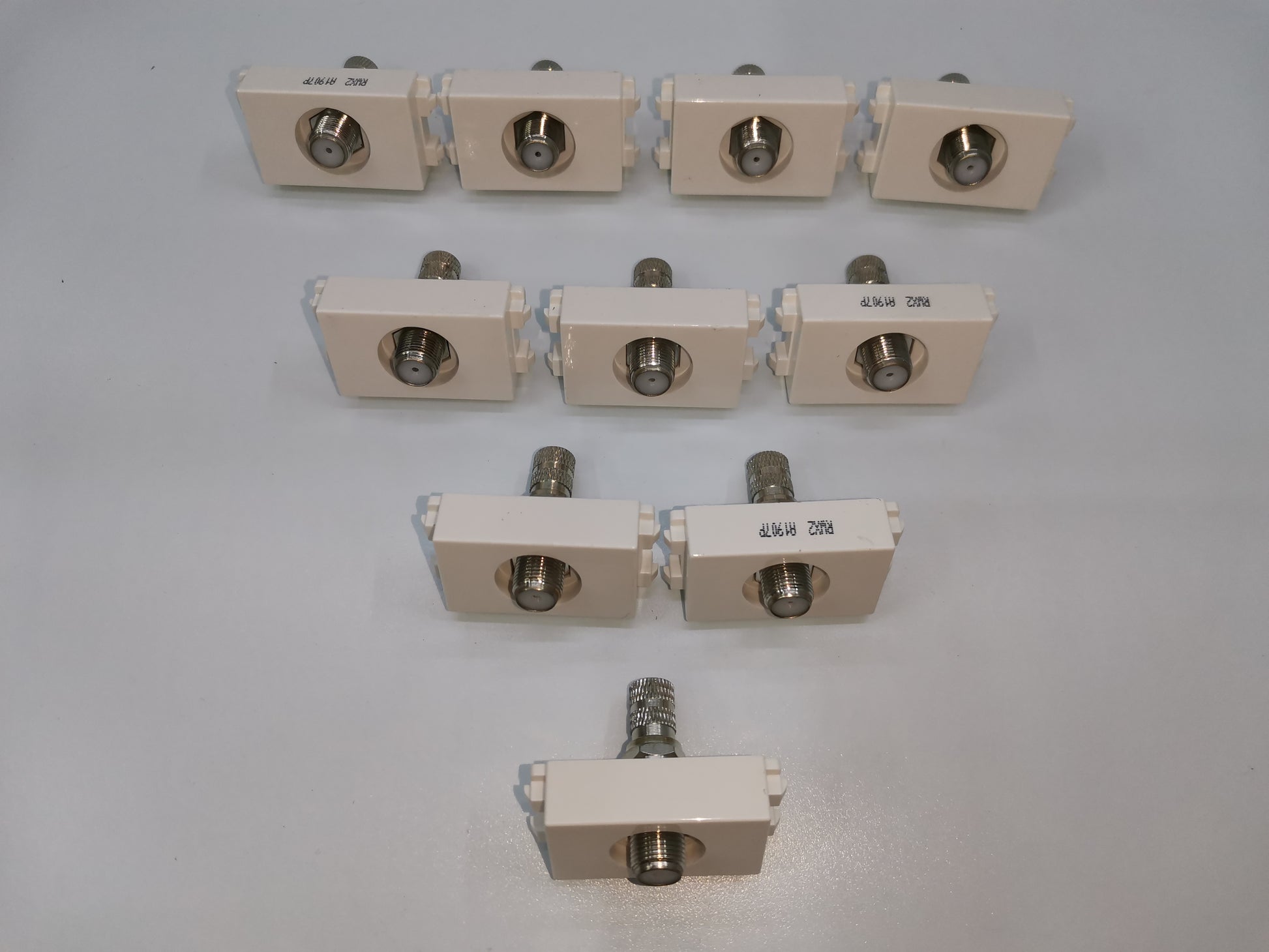 Royu cable TV outlet white connectors arranged in rows for electrical circuitry and parts