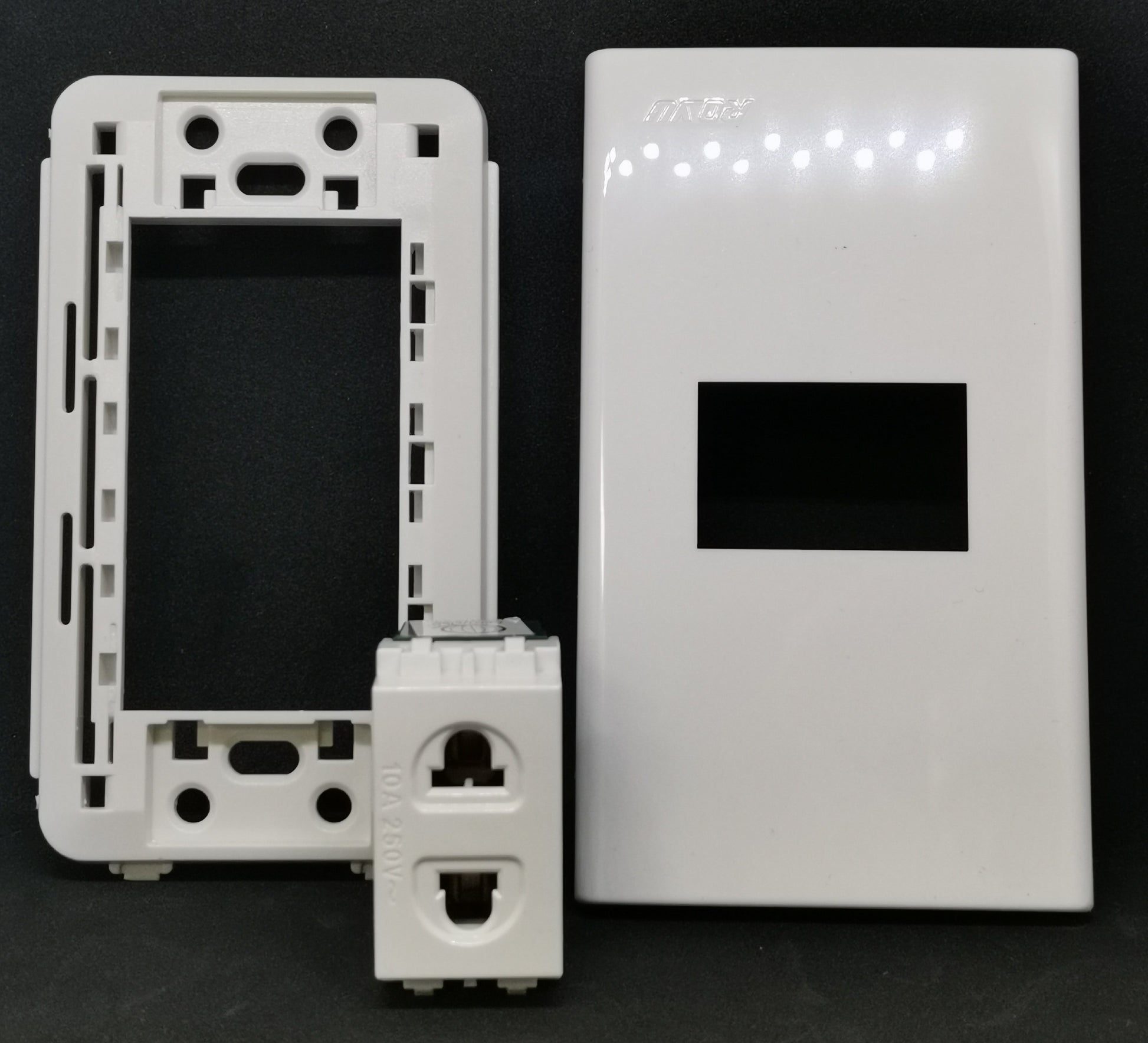 Royu white 1 Gang Universal Outlet with Plate showing glossy faceplate mounting frame and outlet module