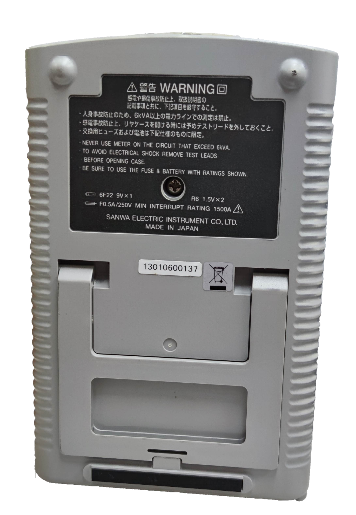 Back view of Sanwa Analog Multi-Tester Capacitance Tester showing battery compartment and warning label