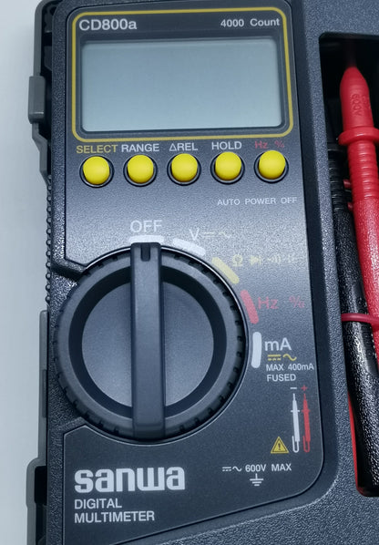 Sanwa CD800a Digital Multimeter with rotary dial and yellow function buttons for electrical testing