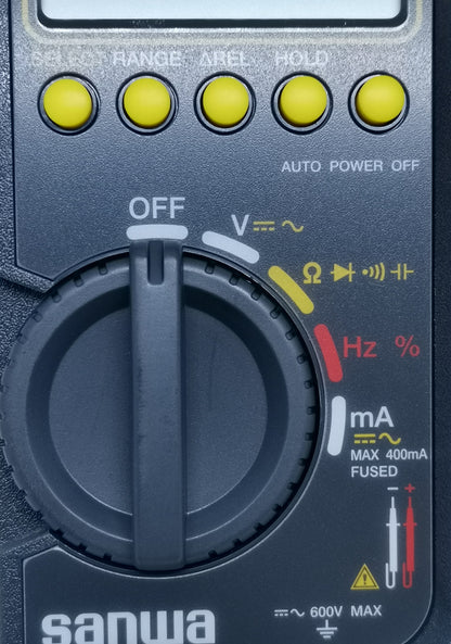 Close-up of Sanwa CD800a Digital Multimeter rotary dial and function buttons for electrical measurements