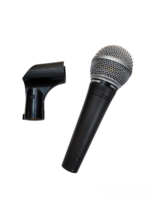Shure Microphone Condenser with metal grille and black handle alongside black microphone clip