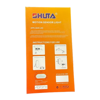 Shuta 30W MOTION SENSOR LED LIGHT OVAL packaging with installation instructions on orange background