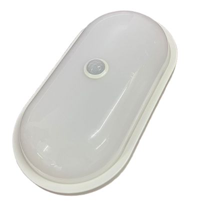 Shuta 30W MOTION SENSOR LED LIGHT OVAL white fixture with central motion sensor on black background