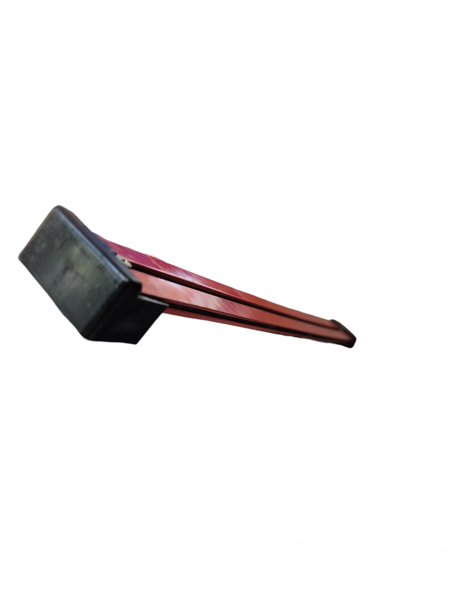Red space saver tool with black rubber handle designed for efficient storage and space management