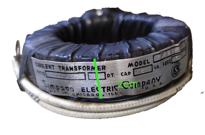 Simpson Single Core Current Transformer black ring style electrical component with white insulated wire