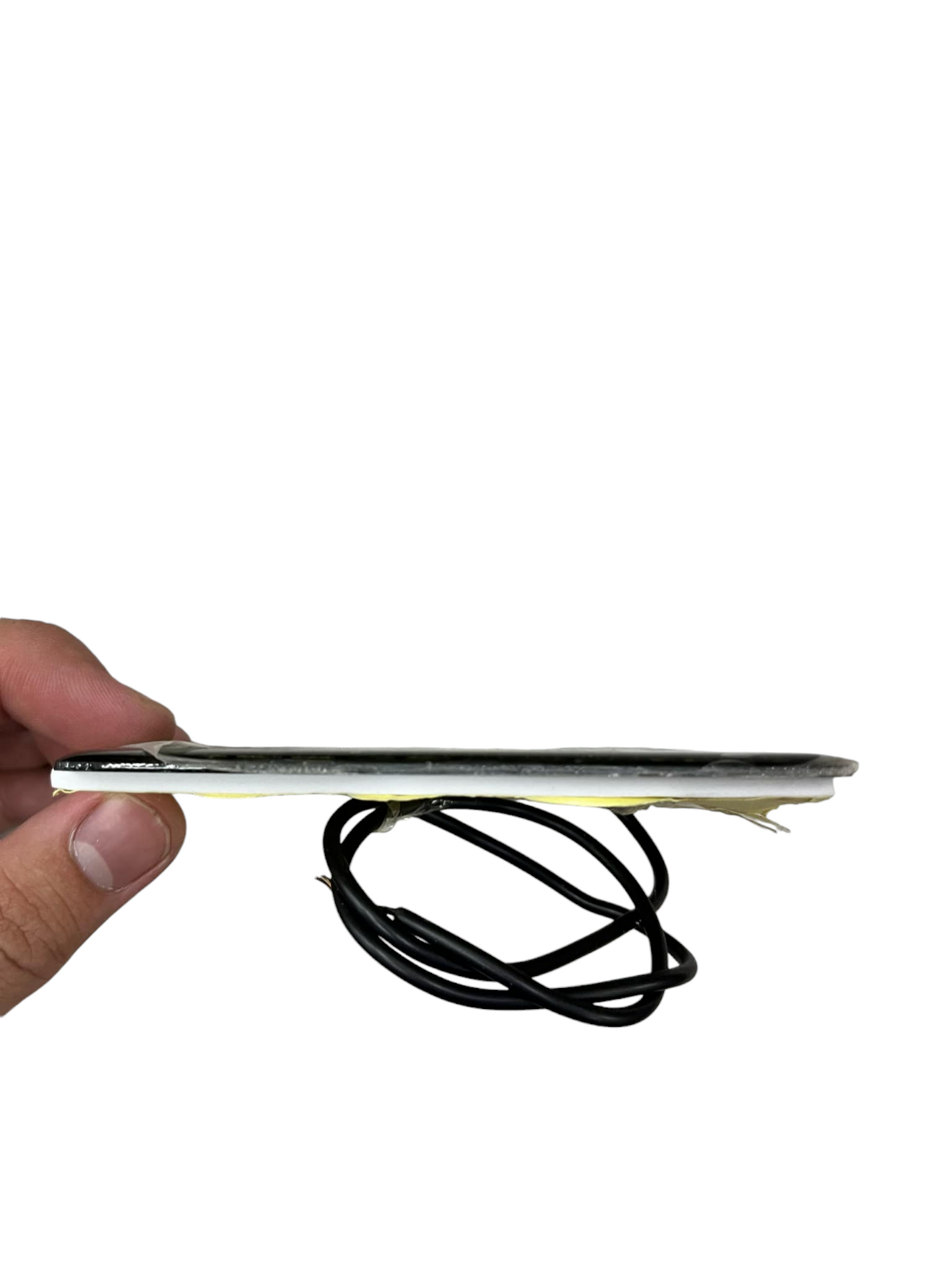 Hand holding thin Solar Panel 6V 1 Watts with attached black wires for electronics projects