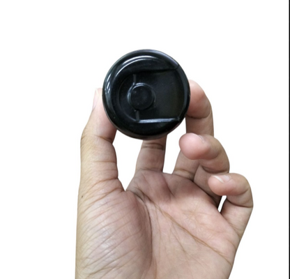 Mallory Starting Capacitor 36-43MFD 125V held in hand, showcasing its compact design and utility.