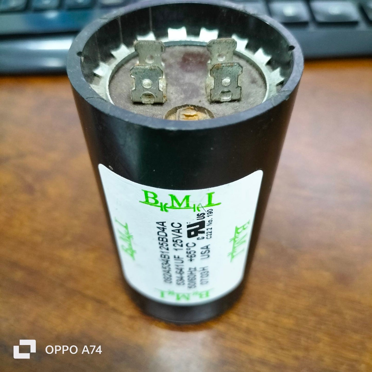 BMI Starting Capacitor 534-641 UF 125V black cylindrical electrical component with metal terminals