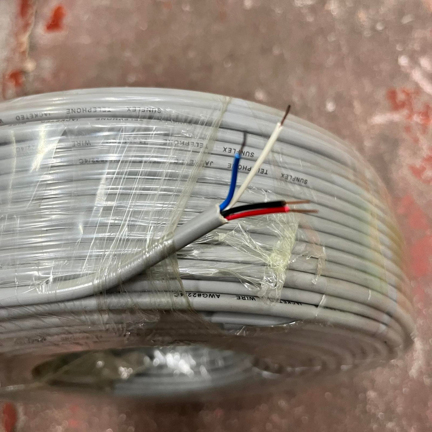 SunFlex hi-pro 22 gauge wire for phones white flat telephone cable coil with blue red black and white conductors