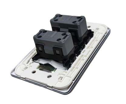 Omni 2 gang illuminated switch rear view showing twin modular switch mechanisms on white mounting frame