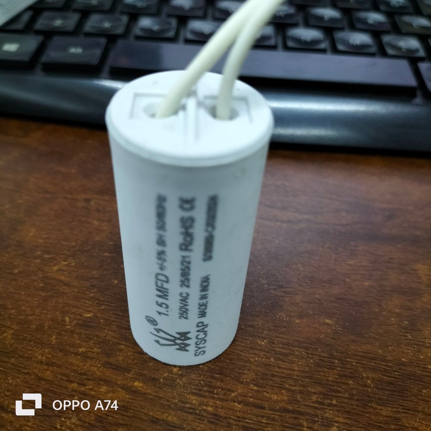 1 MFD 250V AC Motor Run Capacitor from Syscap with two wire connections for electrical applications