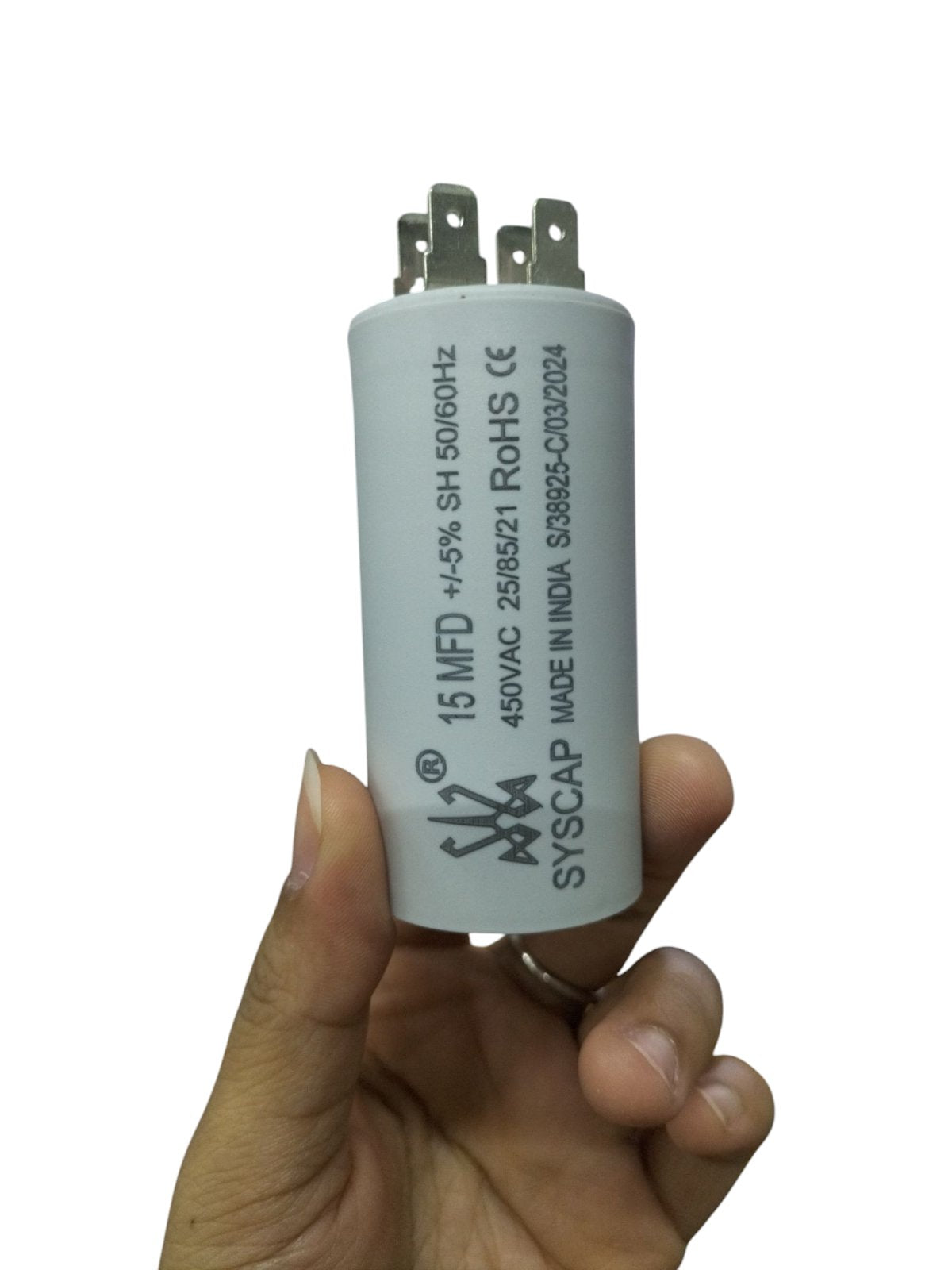 Syscap 15MFD motor running capacitor with white cylindrical body and metal terminals