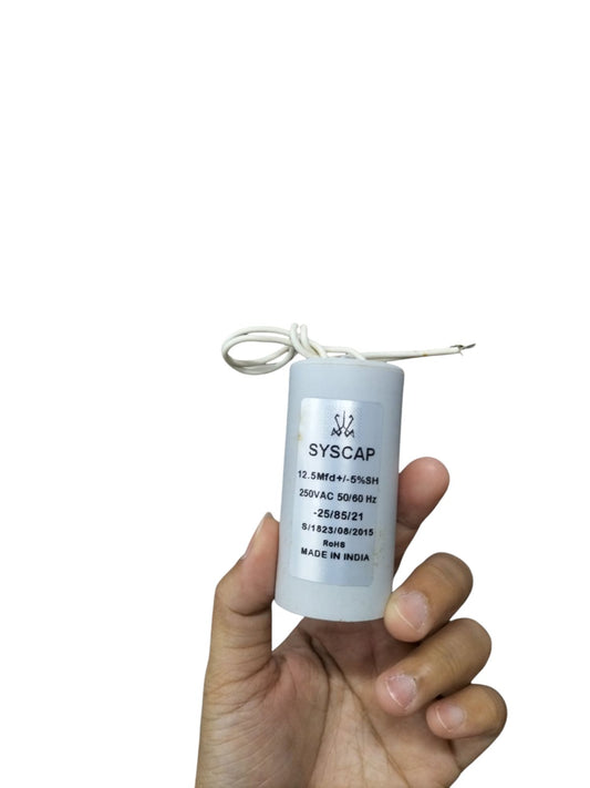Syscap 250 VAC Running Capacitor in hand, designed for electrical circuitry applications