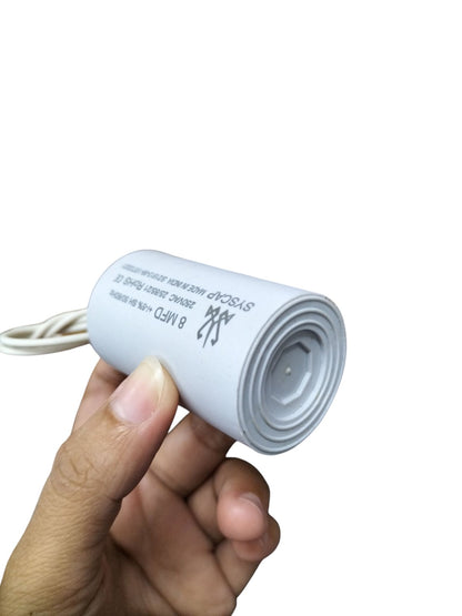 Syscap 8MFD 250 VAC Running Capacitor in Hand for Electrical Applications