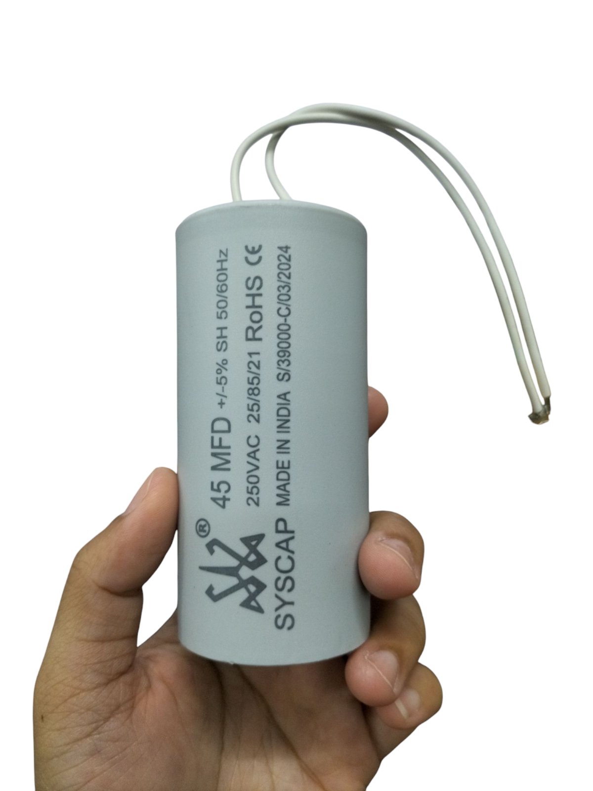 Syscap motor capacitor 50MFD cylindrical white electrical component held in hand with two wires