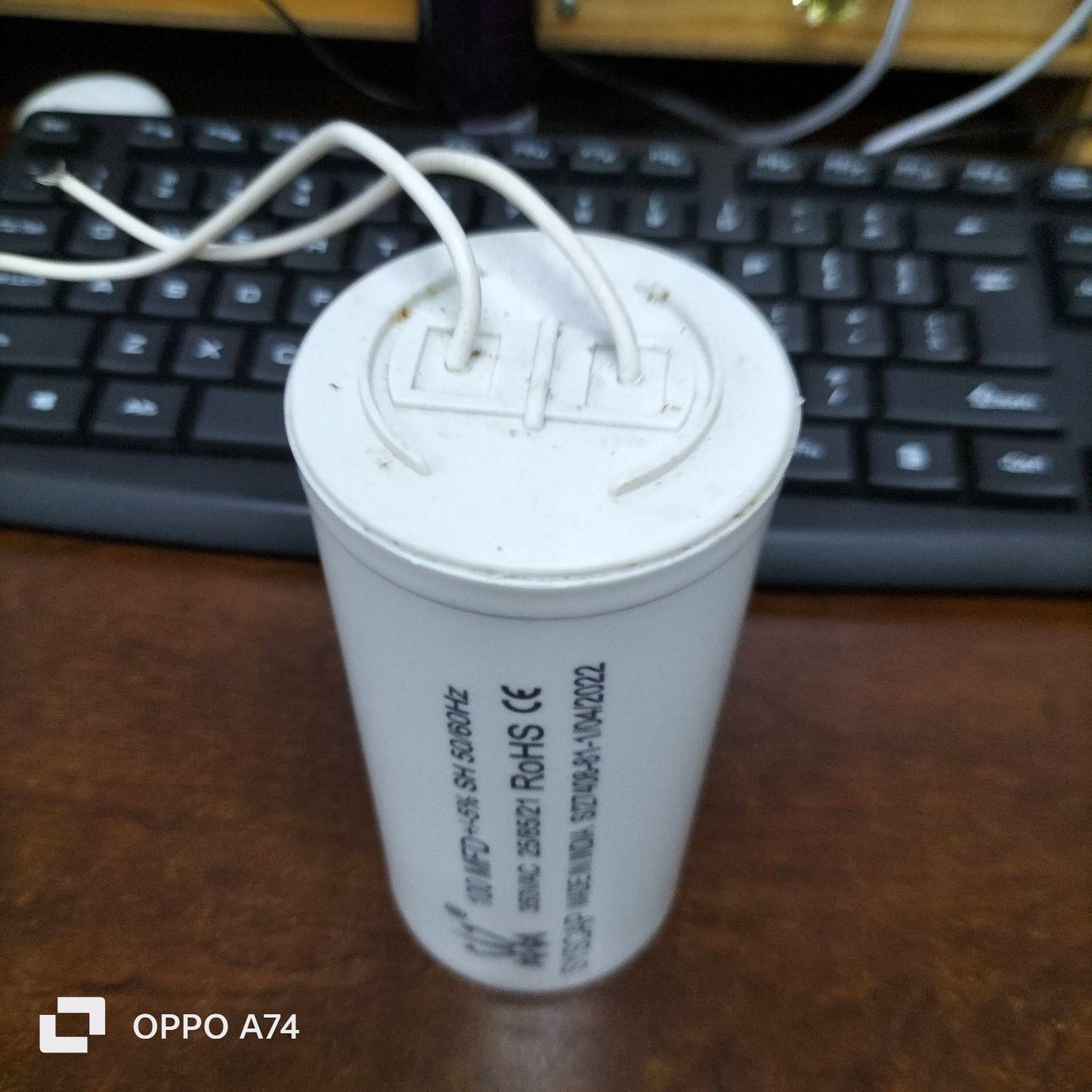Syscap white cylindrical motor capacitor with two white wires