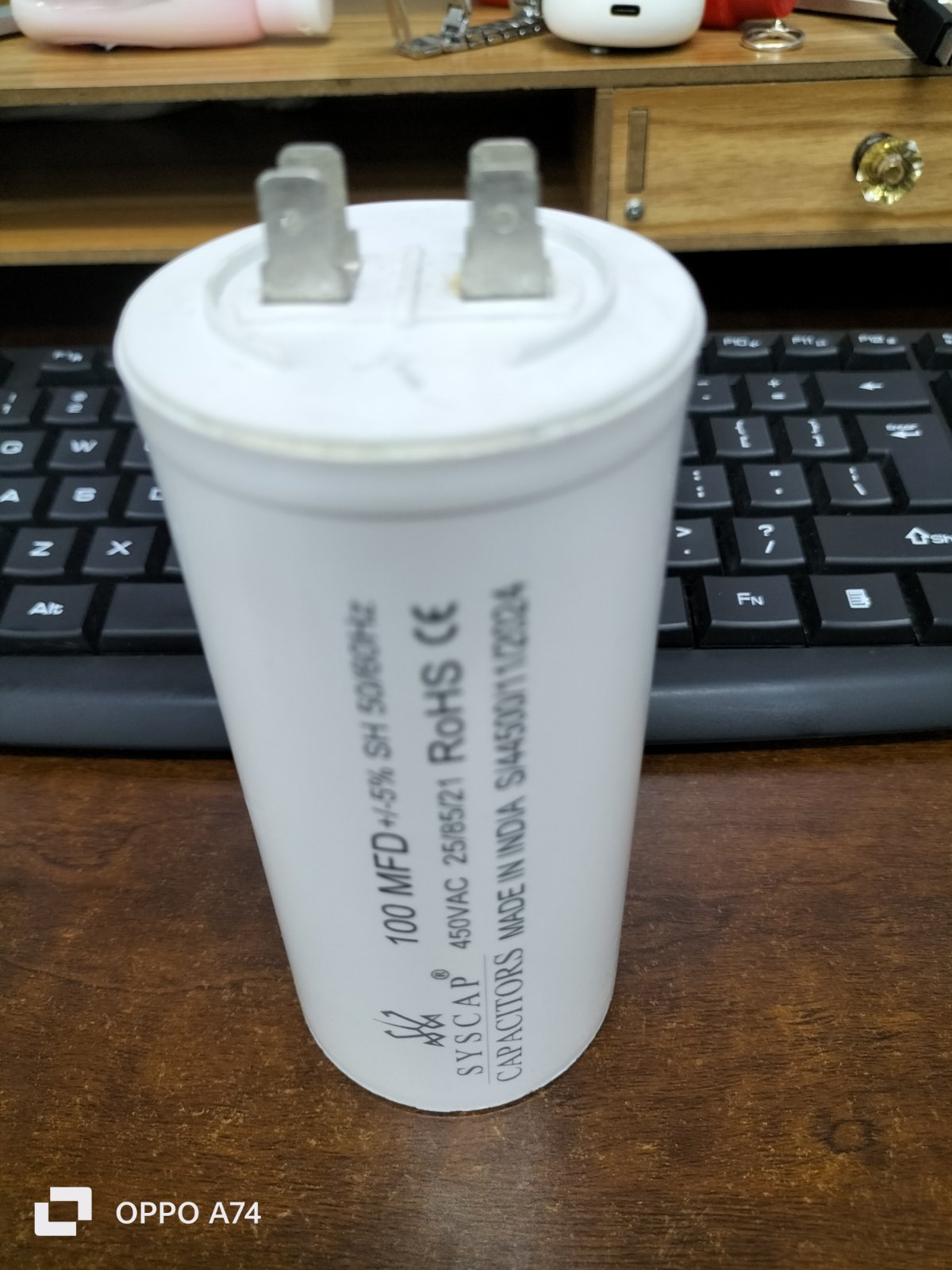 SYSCAP Motor Running Capacitor 100MFD 450V AC white cylindrical electrical component on wooden desk