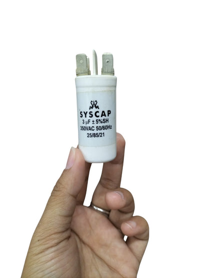 Syscap motor running capacitor 3mfd 350vac held in hand for electrical circuit applications