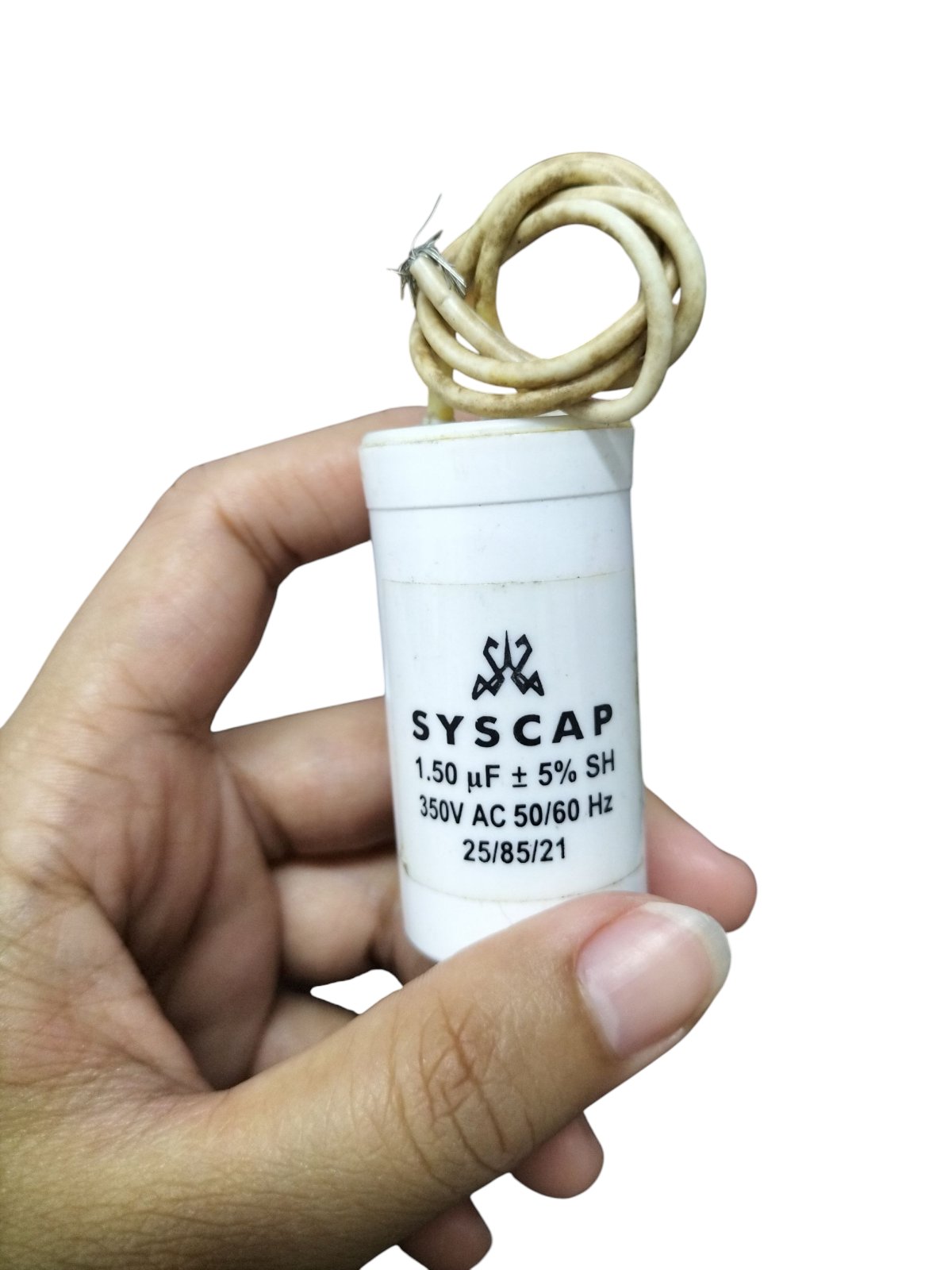 Hand holding Syscap Running Capacitor 1.5MFD 350 VAC white cylindrical motor capacitor with lead wires