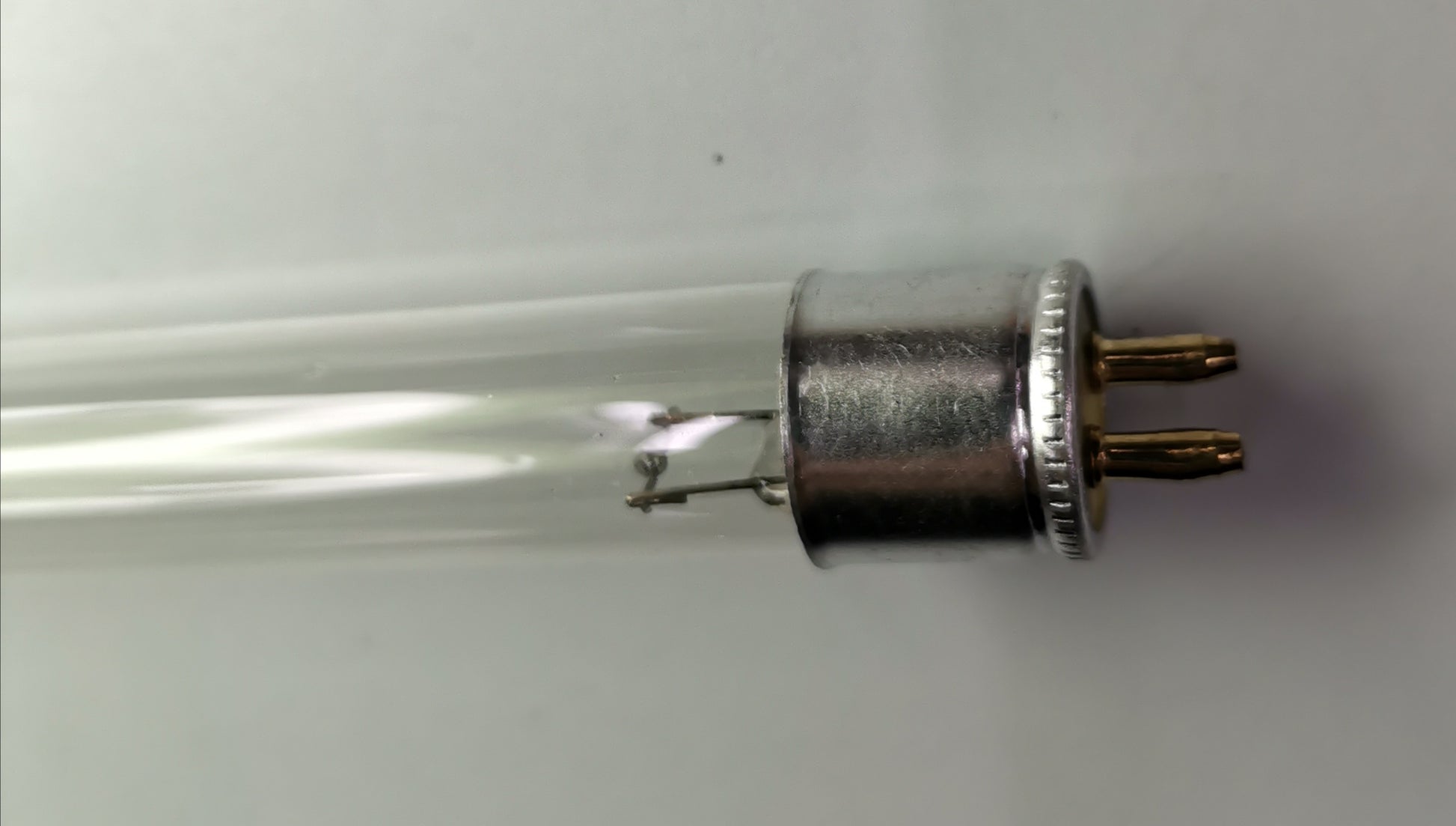Close-up of T5 Fluorescent Lamp 14 Watts tube with metal pins and clear glass from China