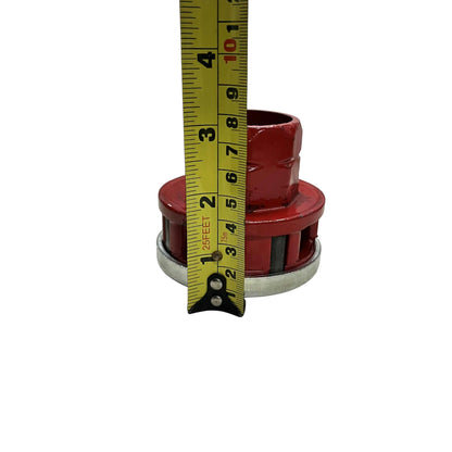 Red ratchet pipe threader set die head accessory photographed with tape measure showing 3 inch height