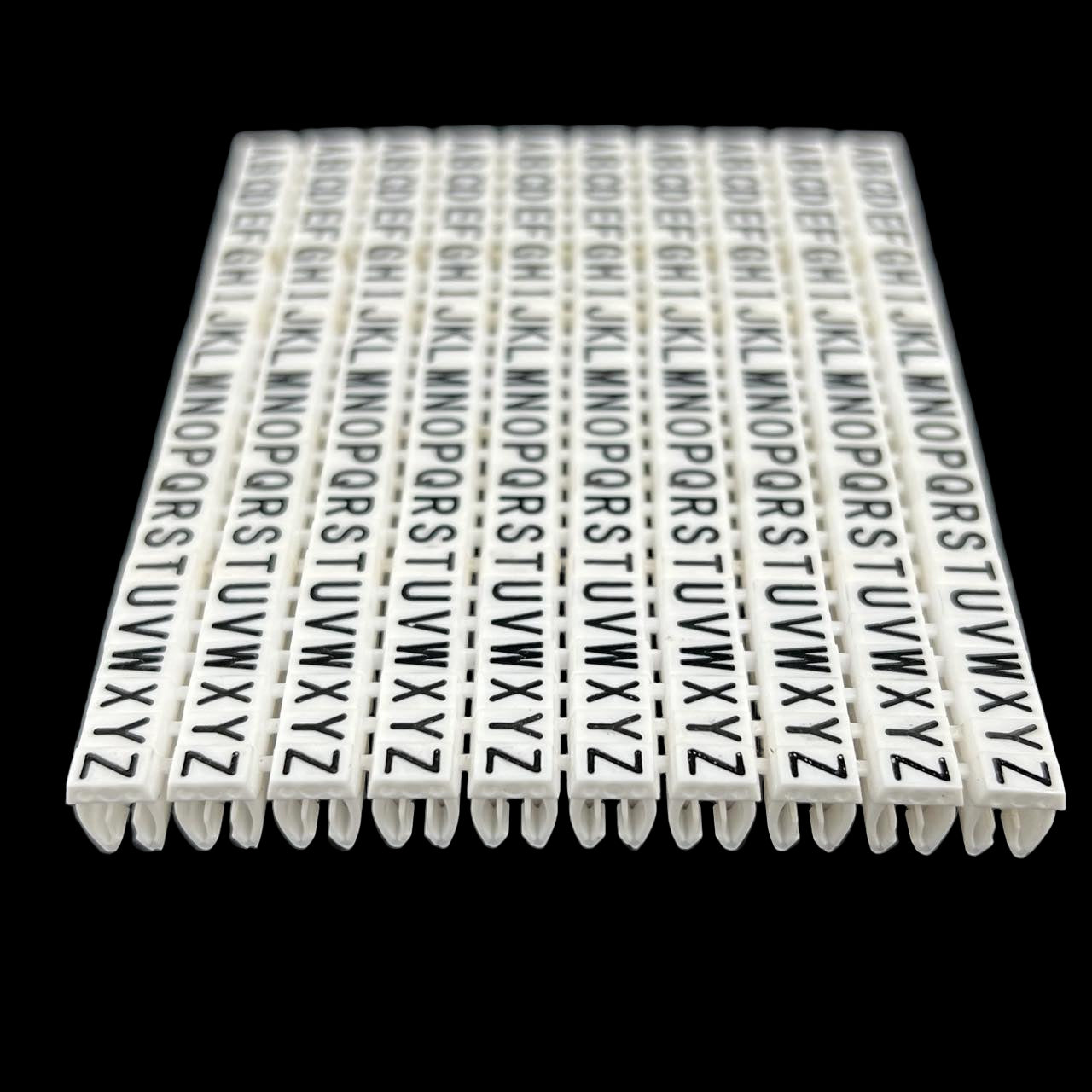 Grippes alphabet cable markers 260pcs white letter clips organized in rows for wire labeling