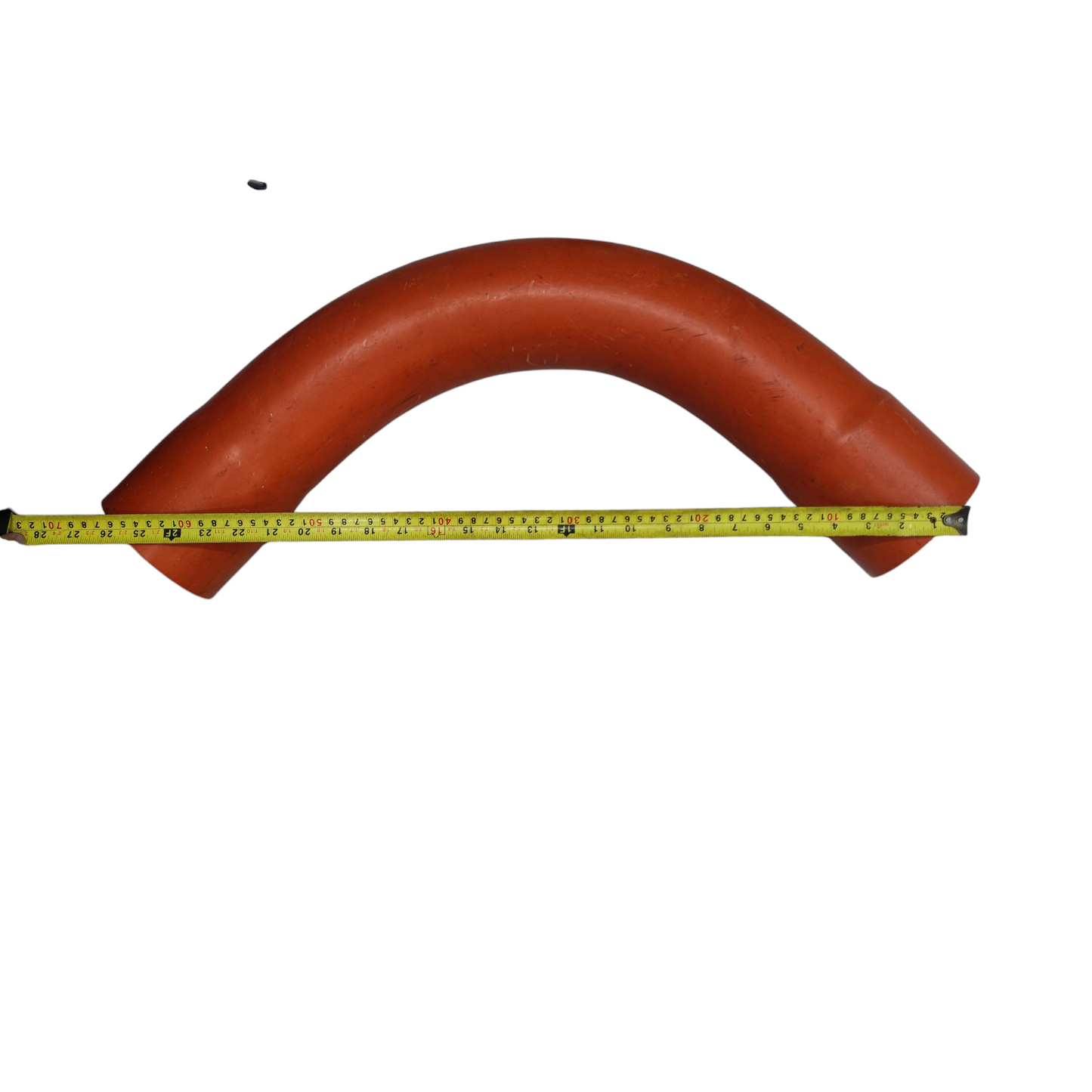 6 inch PVC conduit elbow in orange with measuring tape showing length for Atlanta pipes and tubing