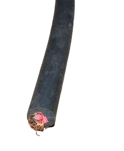Close-up of a black Win Microphone Cable with exposed internal wires on a black background